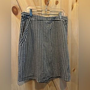 Skies are blue skirt black and white